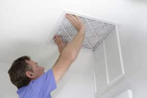 Inserting New Air Filter in Ceiling