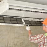 a-young-technician-changing-hvac-air-conditioner-filter